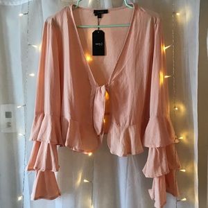 Front-tying blush top